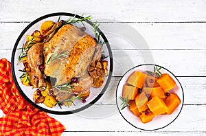 Roasted turkey garnished with cranberries on a rustic style table decorated  autumn leaf. Thanksgiving Day. Baked chicken. Top