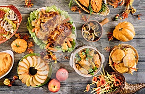 Roasted turkey garnished with many dishes on the table. Thanksgiving Day