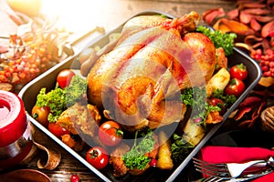 Roasted turkey garnished with potato. Thanksgiving or Christmas dinner photo