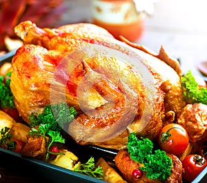 Roasted turkey garnished with potato. Thanksgiving or Christmas dinner