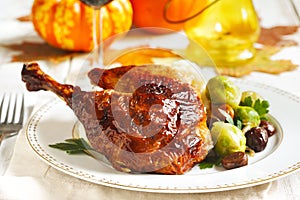 Roasted turkey leg garnished with mash potato, chestnuts andbrussels sprouts