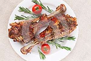 Roasted turkey legs on white plate