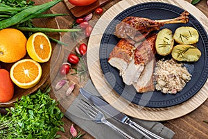 Roasted turkey served on a plate with farofa, crumbs and boiled potatoes. Thanksgiving Day and Christmas dinner