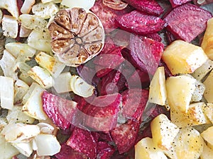 Roasted vegetables. Beetroots, pattypan squash, potatoes, onion and garlic. Top view.