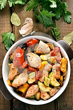 Roasted vegetables with chicken meat in pan