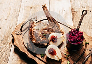 Roasted Venison Haunch with Pears on Wooden Tray