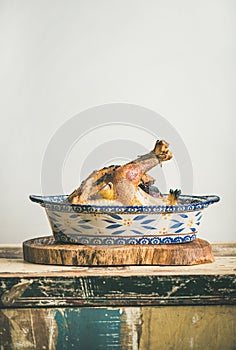 Roasted whole chicken for Christmas eve celebration table, copy space