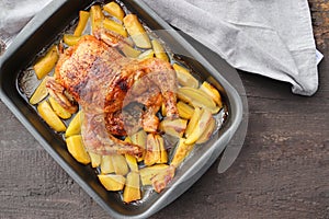 Roasted whole chicken or turkey with potatoes for celebration and holiday. Christmas, thanksgiving, new year's eve