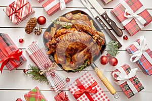 Roasted whole chicken or turkey served in iron pan with Christmas decoration