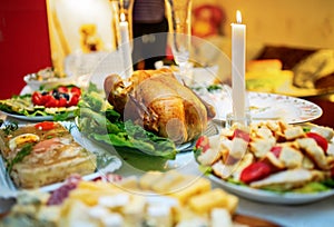 Roasted whole turkey on festive table for Thanksgiving Day.