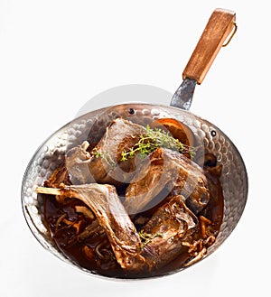 Roasted wild rabbit venison portions in a pan