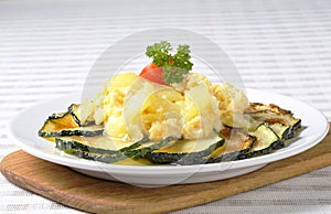 Roasted zucchini with potato egg scramble