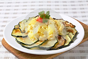 Roasted zucchini with potato egg scramble