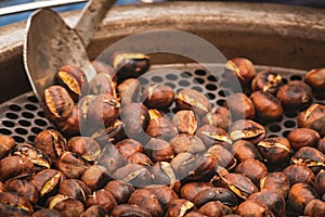 Roasting chestnuts in a bowl or grill on an open fire