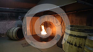 Roasting oak barrels for wine in a cooperage