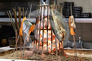 Robatayaki or Japanese barbecue with fresh meat grilled on charcoal