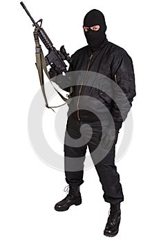 Robber in black uniform and mask with m4 rifle