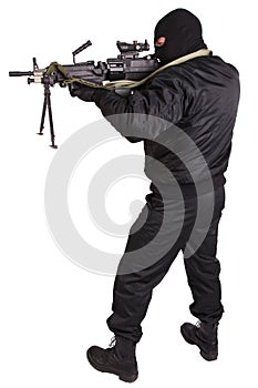 Robber in black uniform and mask with machine gun