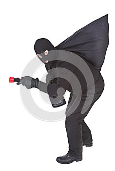 Robber with flashlight and sack