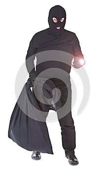 Robber with flashlight and sack isolated