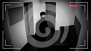 Robber in mask looking surveillance camera, corporative building protection photo
