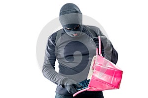 Robber pulls out a purse from a female bag on a white