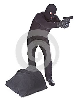 Robber with sack aiming with his gun