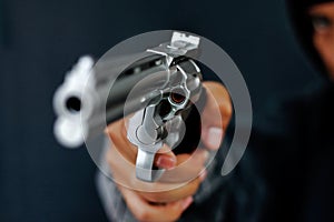 Robber used the gun to robbery the money