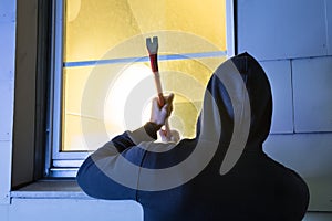 Robber Using The Crowbar To Open The Glass Window