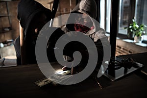 Robbers stealing money