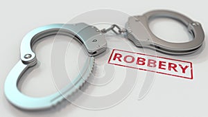 ROBBERY stamp and handcuffs. Crime and punishment related conceptual 3D rendering