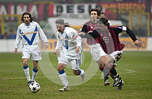 Roberto Baggio and Paolo Maldini in action during the match