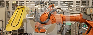 Robot arms in the factory performs precise work according to the specified program