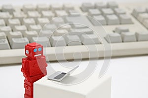 Robot or artificial intelligence and laptop with the keyboard on white background.