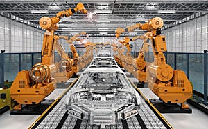 Robot assembly line in car factory photo