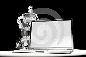 Robot with blank screen laptop. Image containc lipping path of laptop screen and entire scene photo