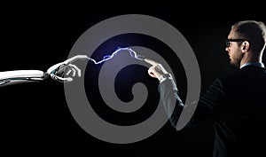 Robot and businessman connected by lightning