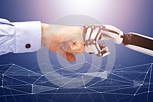 Robot And Businessman`s Hand Making Fist Bump