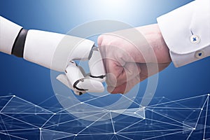 Robot And Businessman`s Hand Making Fist Bump