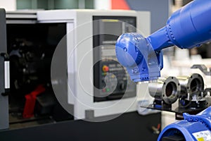 robot and the CNC lathe machine