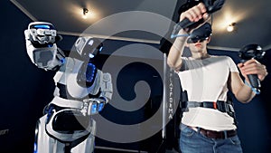 A robot copies man`s movements. Robotic VR cybernetic gaming system.
