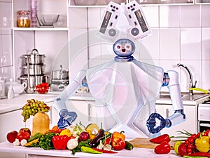 Robot domestic assistance cook vegetarian food at kitchen. photo