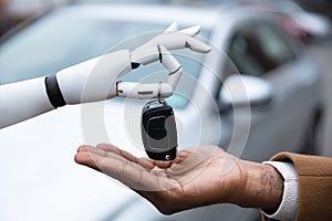 Robot Giving Car Key To Man