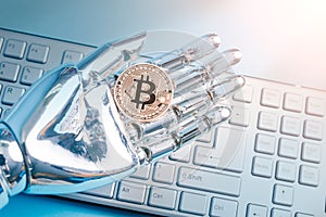 Robot hand with bitcoin