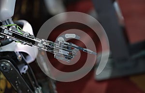 Robot hand pointing with index finger and touching gesture