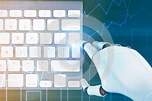 Robot hand typing on a computer keyboard, graphs