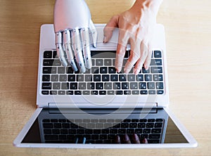 Robot hands and fingers point to laptop button advisor chatbot robotic artificial intelligence photo