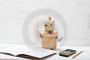 Robot holding a pen and wrote in a notebook.the working process