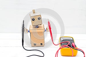 Robot holds voltmeter. horizontal photo