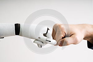 Robot And Human Hand Making Fist Bump